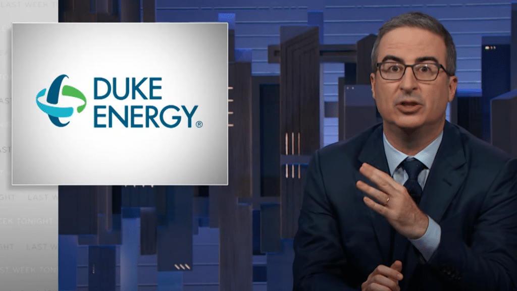 John Oliver discusses utility scandals next to a title card displaying the logo of Duke Energy.