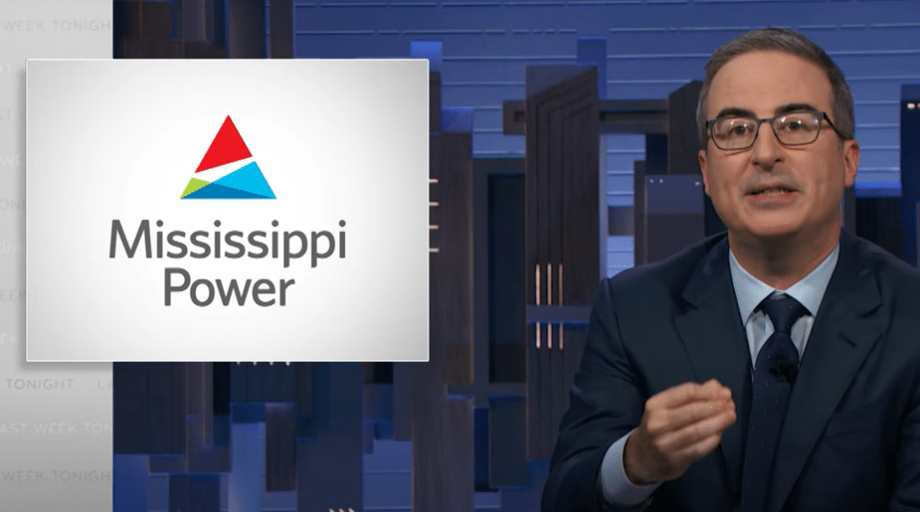 John Oliver discusses utility scandals next to a title card displaying the logo of Power.